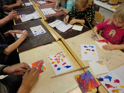 two parts of the same obect painted by child and parent together