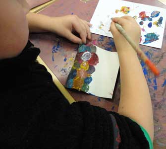 two parts of the same obect painted by child and parent together